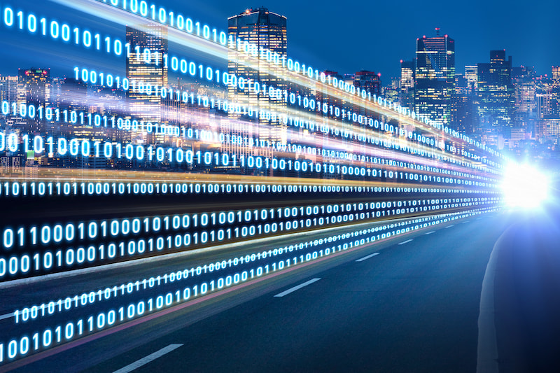 Imagine of blue city scape with binary code to represent the Highway of digital signals Imagine of blue city scape with binary code to represent the Highway of digital signals